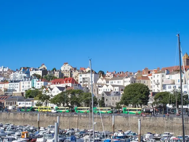 Port city with moored boats and colorful buildings
