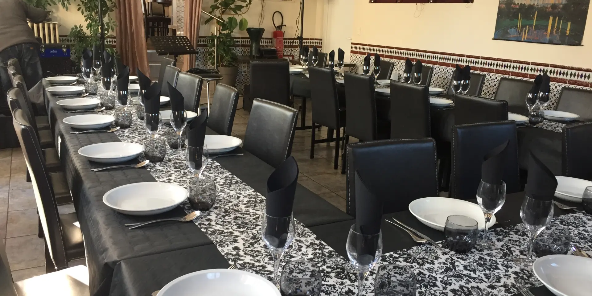 Restaurant dining room with tables set for dinner