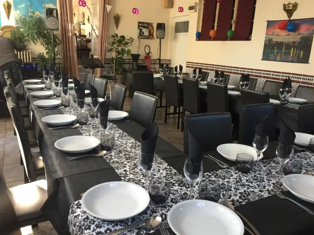 Restaurant dining room with tables set for dinner