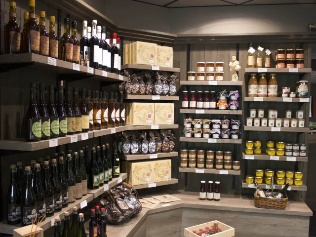 Shelves filled with bottles of wine and food products