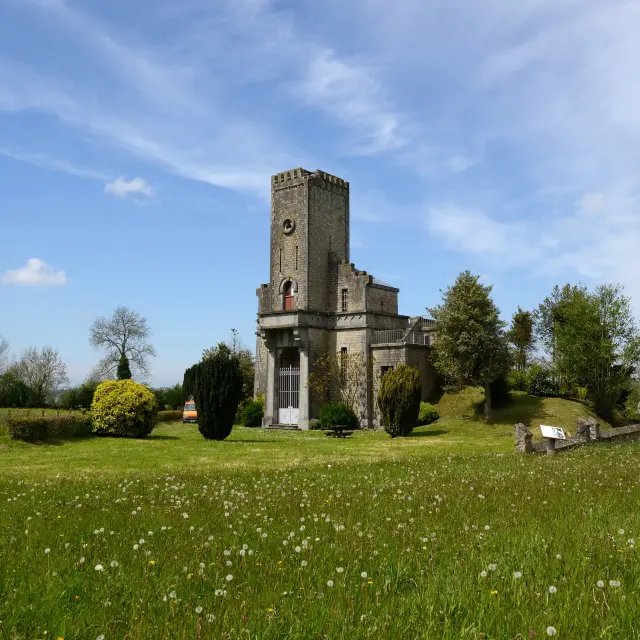 Old stone church with a bell tower and a cemetery