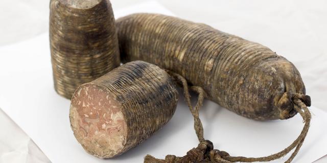 Three artisanal sausages with strings