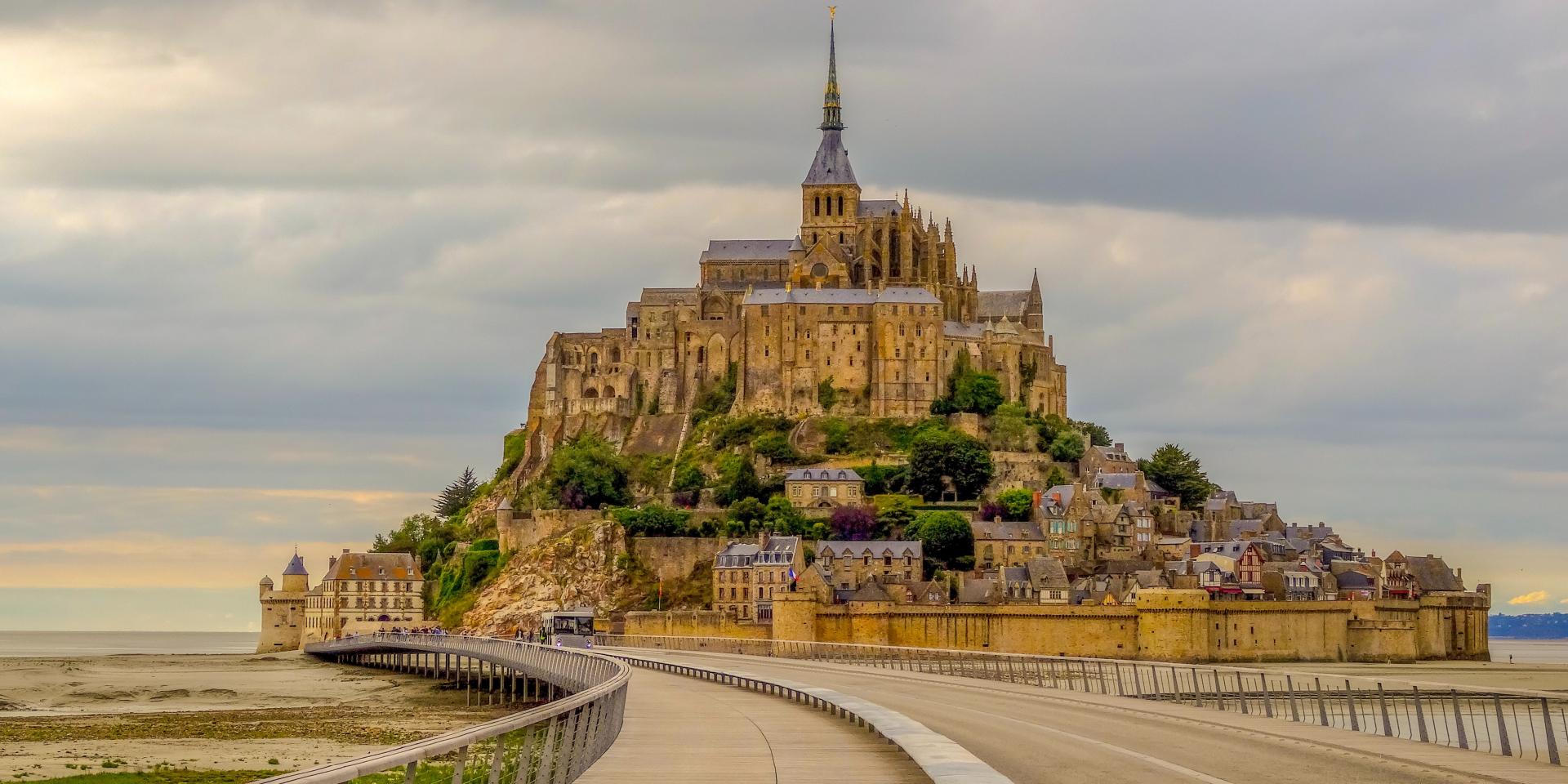 Mont Saint-Michel with a road leading to the main structure