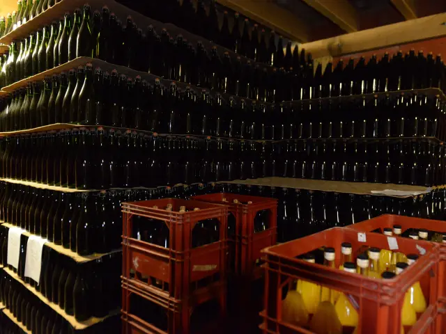 Shelves filled with bottles of wine and crates of bottles