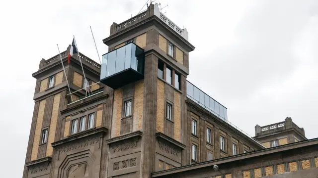 A historic building with a modern glass extension