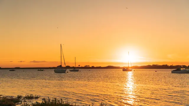 Boats on the water at sunset