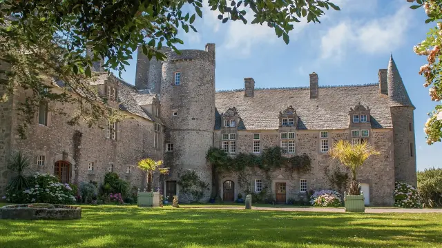 Medieval castle with a large courtyard and plants