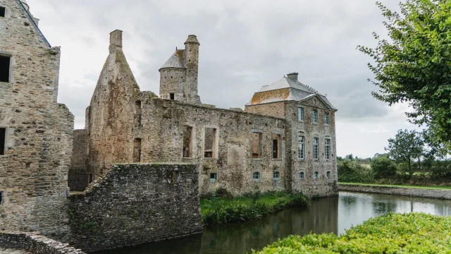 Medieval castle in ruins surrounded by water