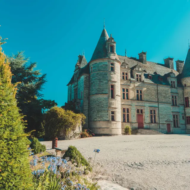 Medieval castle with pointed towers and a gravel courtyard