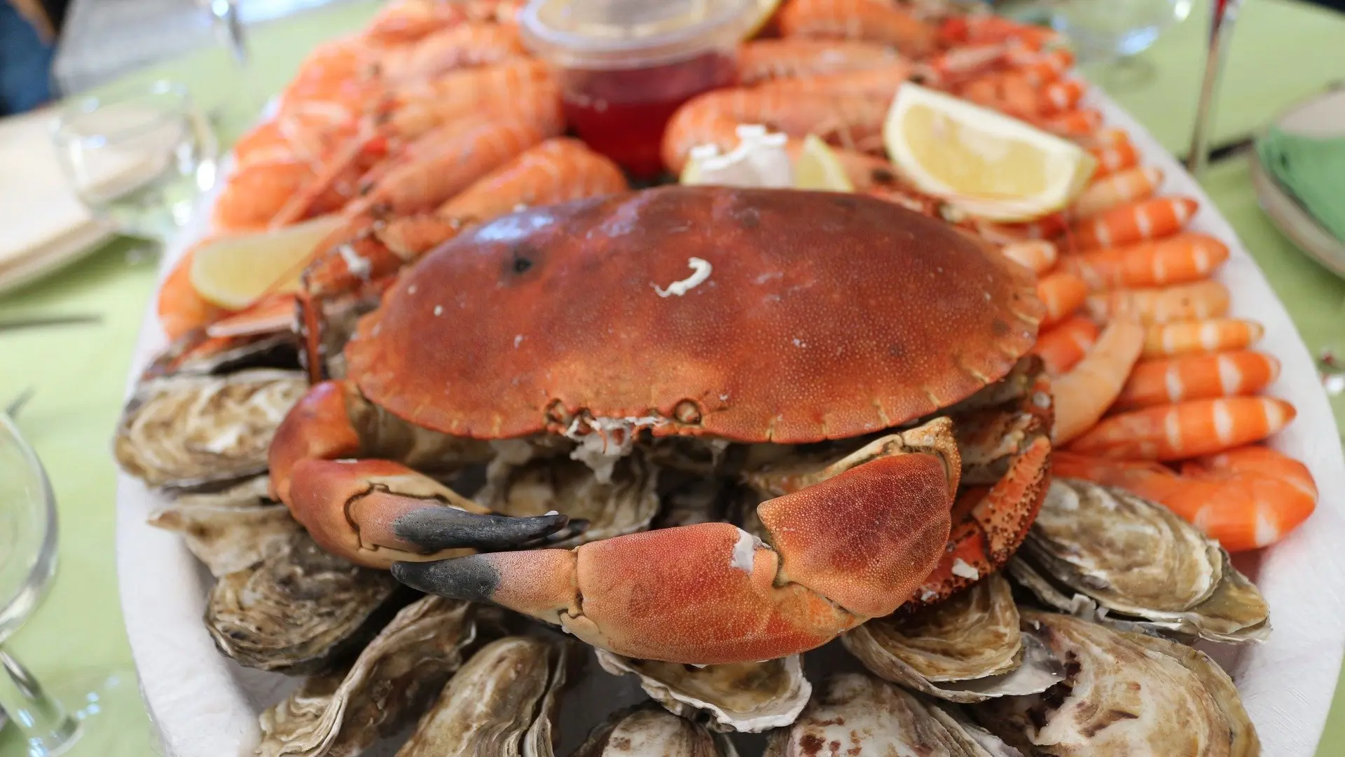 Plate of seafood with crabs, shrimp, and oysters