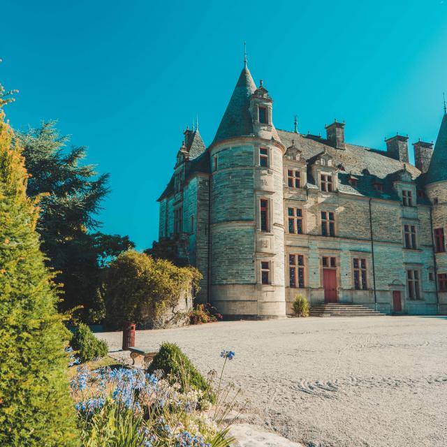Medieval castle with pointed towers and a gravel courtyard