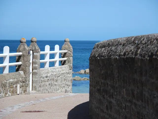 Stone railing with a view of the sea