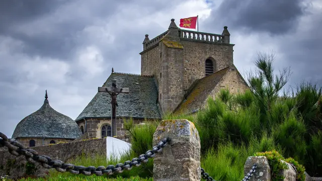 Medieval fortress with a red flag on a tower