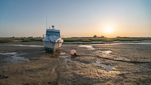 Boat stranded on the beach at low tide