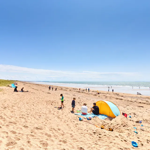 Group of people enjoying a sunny day at the beach