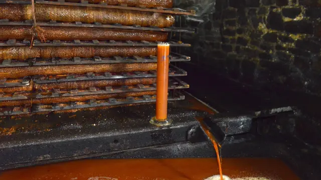 Sausage machine in action with sausages being made