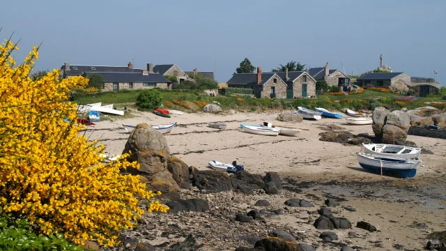 Coastal village with boats on the beach and houses in the background