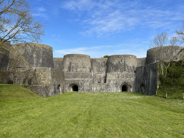 Medieval fortress ruins with three stone towers
