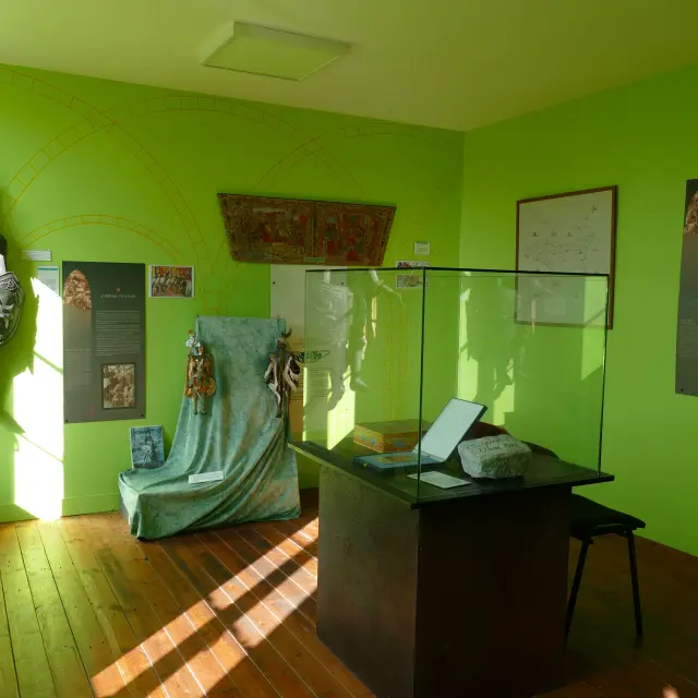 Exhibition room with historical artifacts and information panels