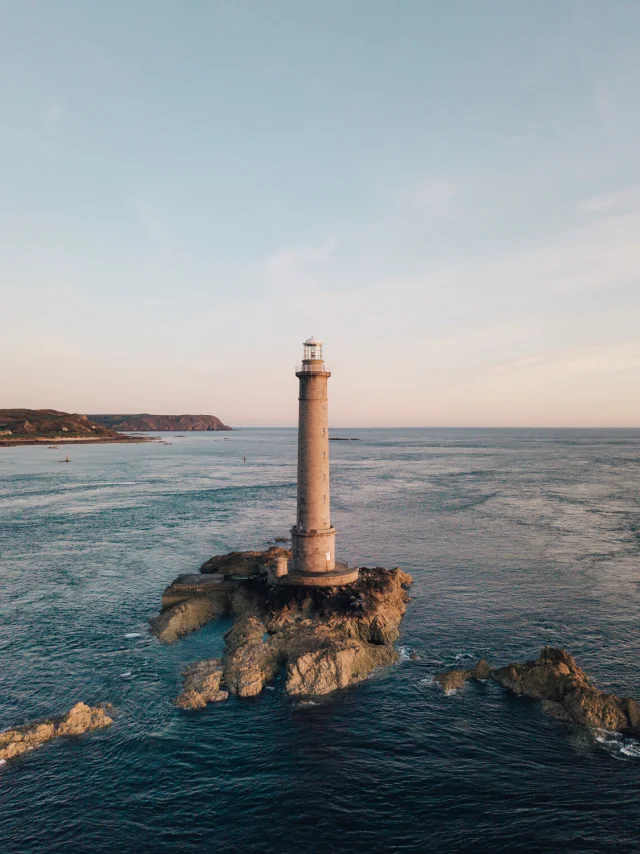 Lighthouse on rocks in the middle of the sea